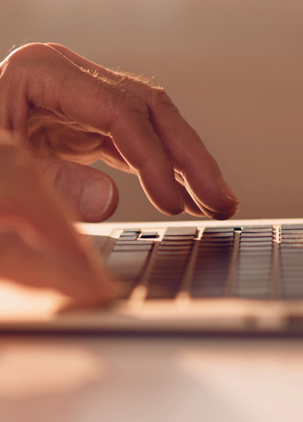 A person works on a laptop