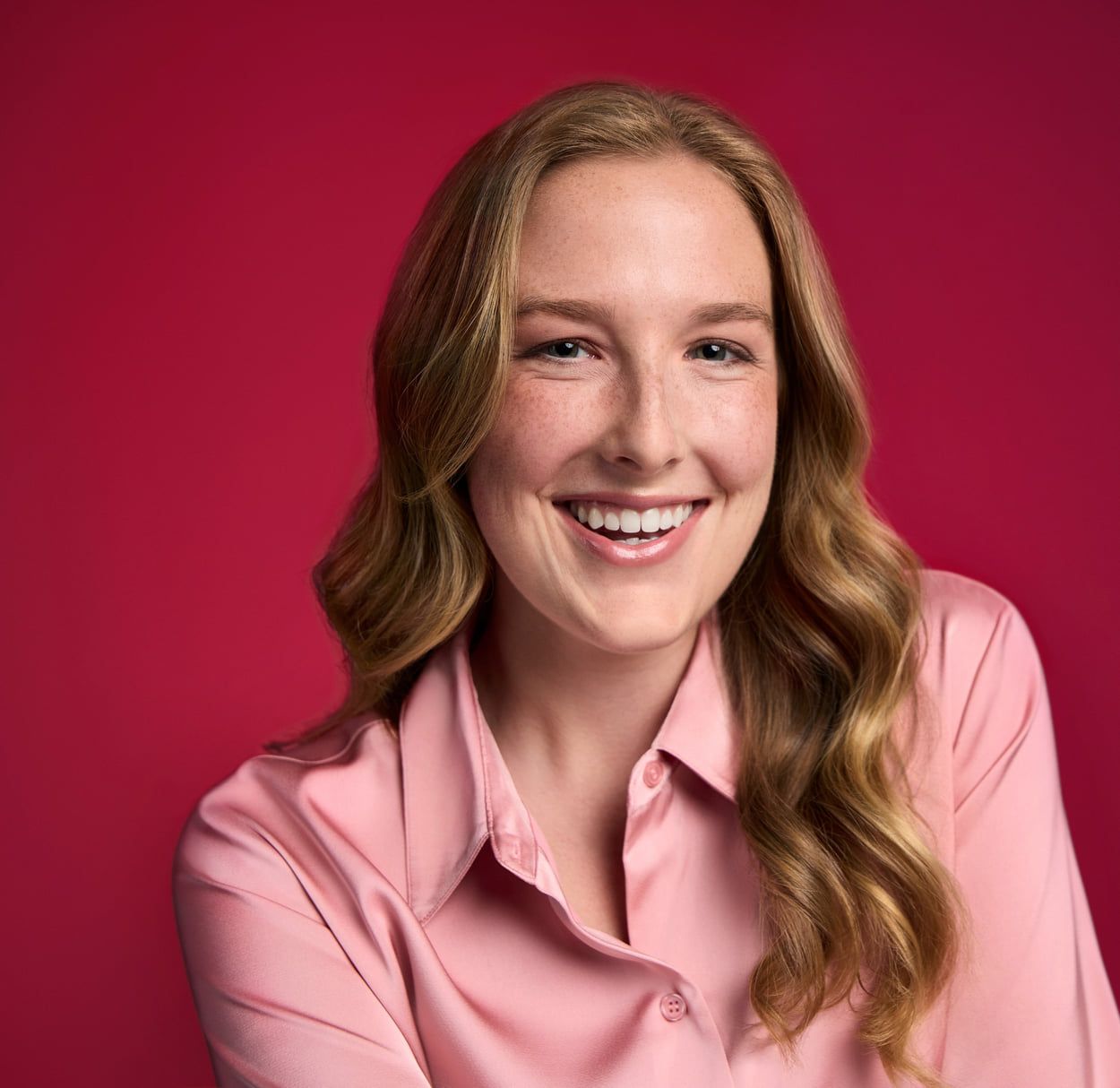 A woman smiles and laughs