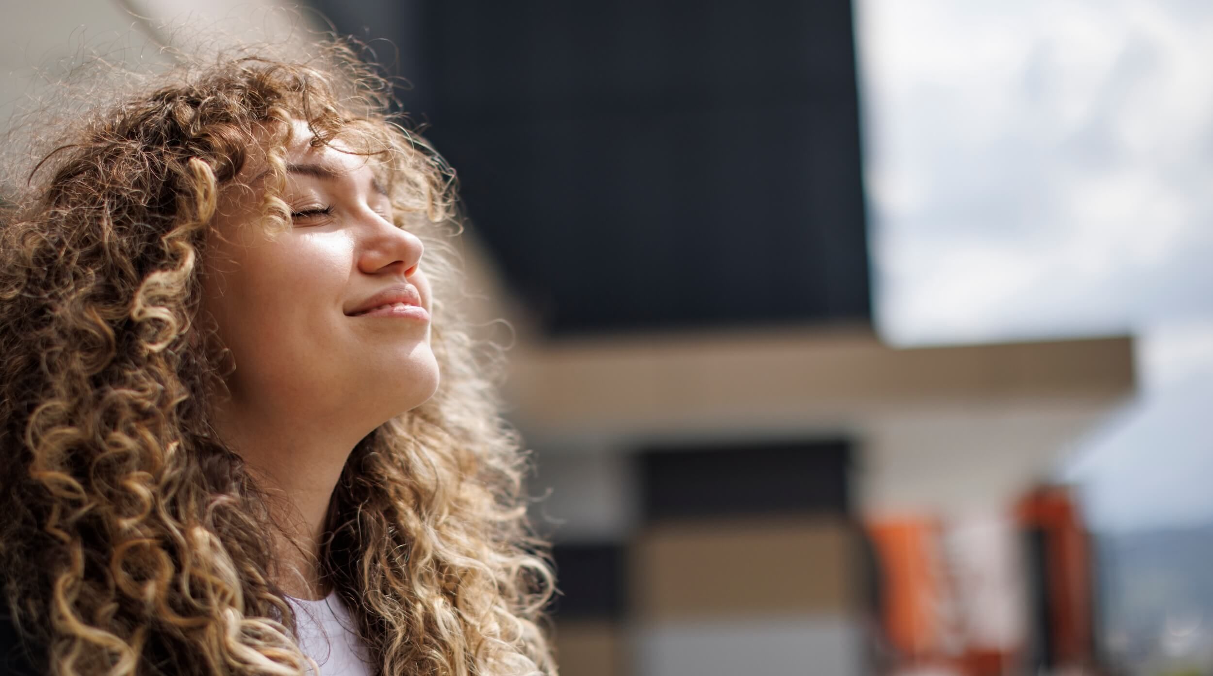 A woman's face basking in the sun